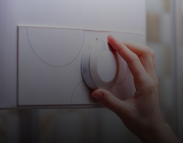 Hand an einem Gasregler